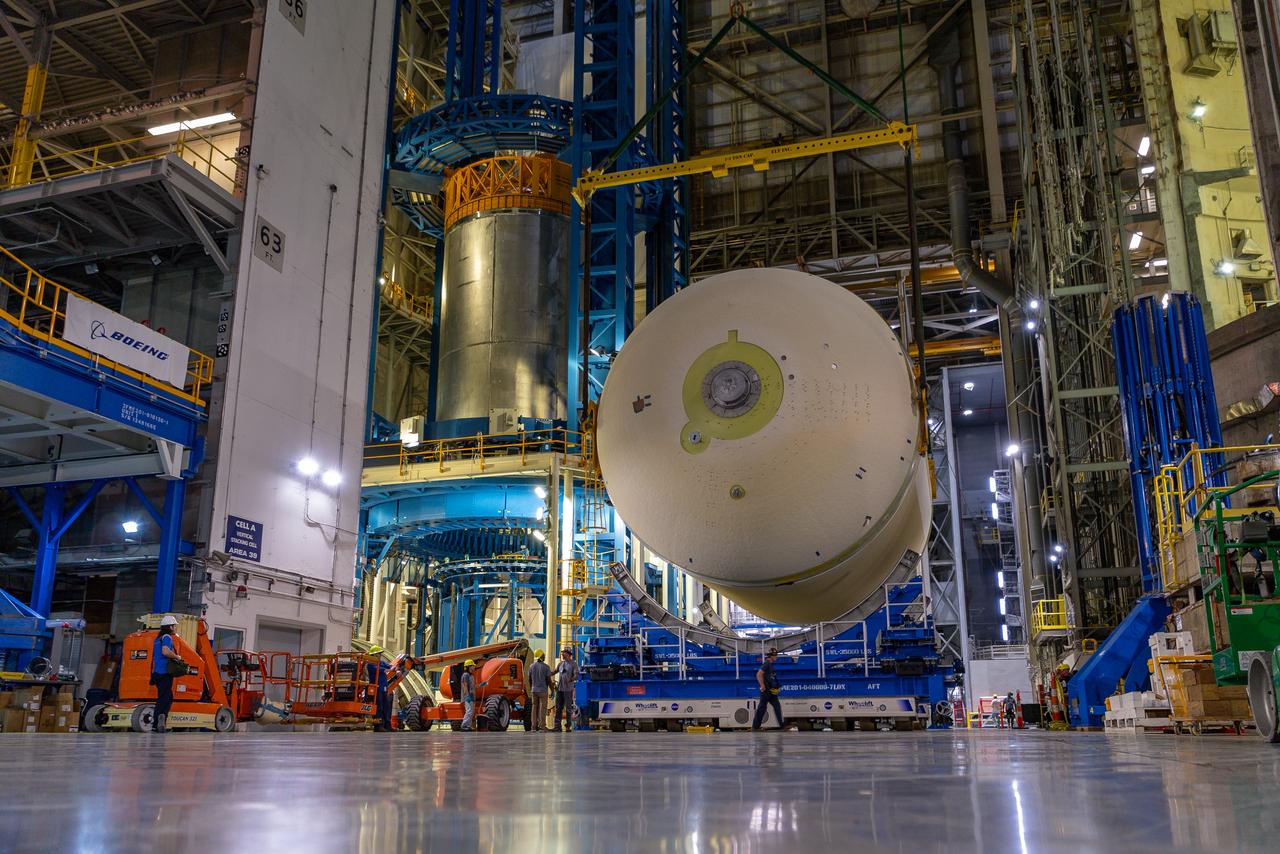 Move crews at NASA’s Michoud Assembly Facility in New Orleans perform “breakover” operations on a liquid oxygen tank in the facility’s vertical assembly building on Aug. 22, 2025. During the breakover, teams lifted the tank from its vertical configuration inside of a production cell and set it horizontally atop self-propelled mobile transporters for transfer to the final assembly production area. There, it will undergo integration of the forward dome by SLS (Space Launch System) prime contractor, Boeing. Eventually, the liquid oxygen tank will be moved back to the high bay where it will be mated with the intertank and forward skirt to complete the forward join of the Artemis III core stage. The propellant tank is one of five major elements that make up the 212-foot-tall rocket stage. The core stage, along with its four RS-25 engines, produce more than two million pounds of thrust to help launch NASA’s Orion spacecraft, astronauts, and supplies beyond Earth’s orbit and to the lunar surface for Artemis.